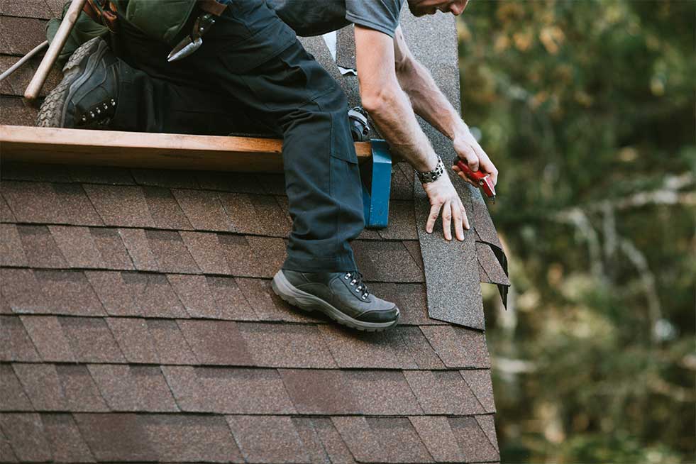 roof shingles being installed